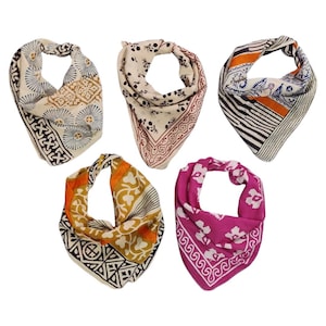 May include: Five patterned bandanas in various designs and colors. The bandanas feature floral, geometric, and abstract patterns in shades of white, black, brown, orange, yellow, and pink. Each bandana is folded and displayed against a white background.