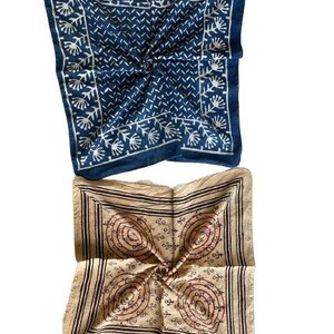 May include: Two square cotton bandanas, one blue with a white floral pattern and the other beige with a brown floral pattern.
