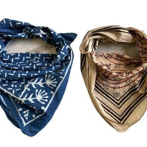 May include: Two cotton bandanas with different patterns. One is blue with a white floral design and the other is beige with brown and red stripes and a floral design.