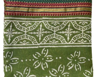 May include: Green fabric with a white floral pattern and a gold, red, and green border.
