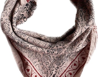 May include: A pink bandana with a black and red floral pattern. The bandana has a fringed edge.