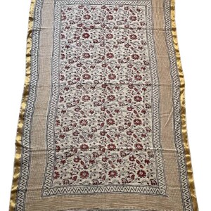 May include: A white cotton fabric with a red floral print and a gold border. The fabric has a traditional Indian design.