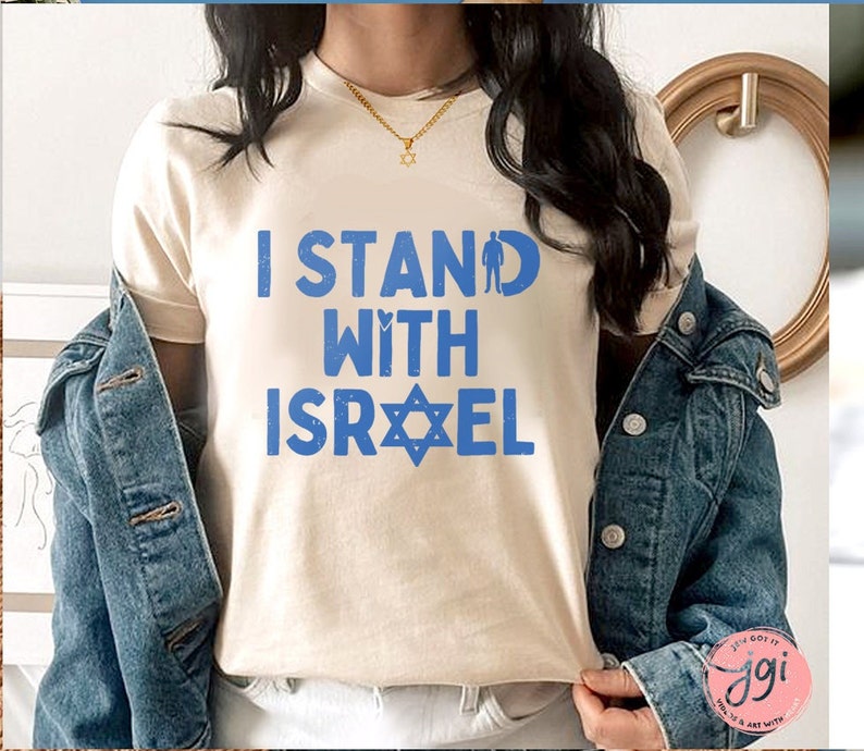 May include: A white t-shirt with the text "I Stand With Israel" in blue letters and a blue Star of David.