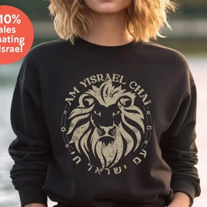 May include: Black sweatshirt with a lion graphic and the text "Am Yisrael Chai" in Hebrew and English. The graphic is surrounded by stars.