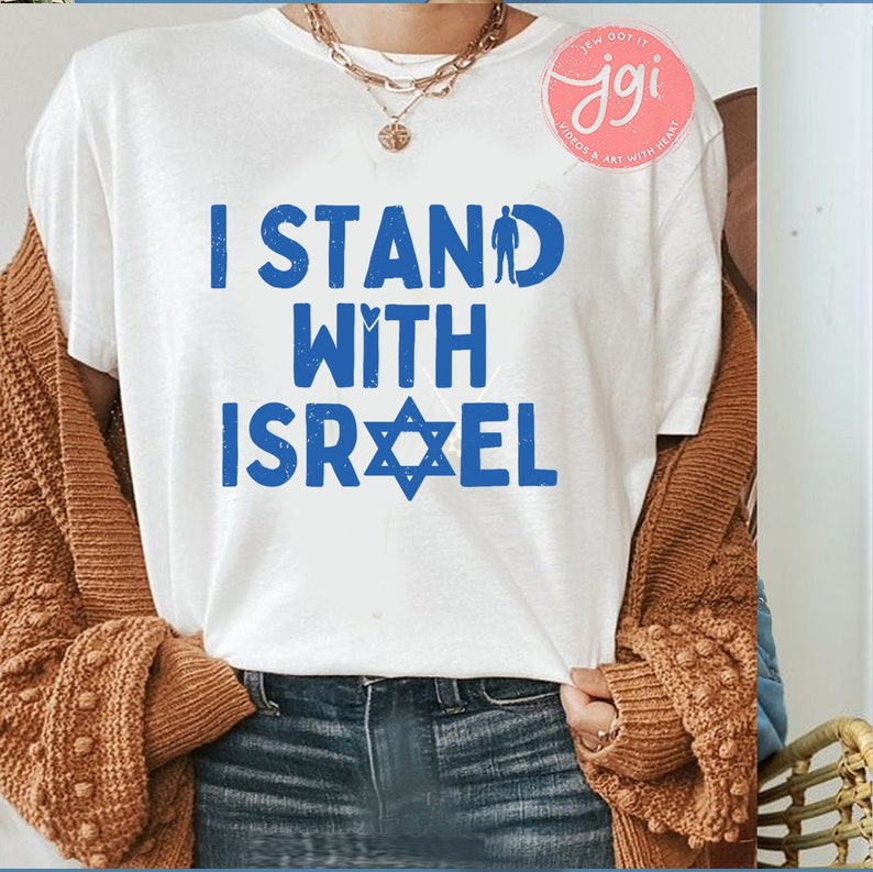 May include: White t-shirt with blue text that reads "I Stand With Israel" and a blue Star of David.