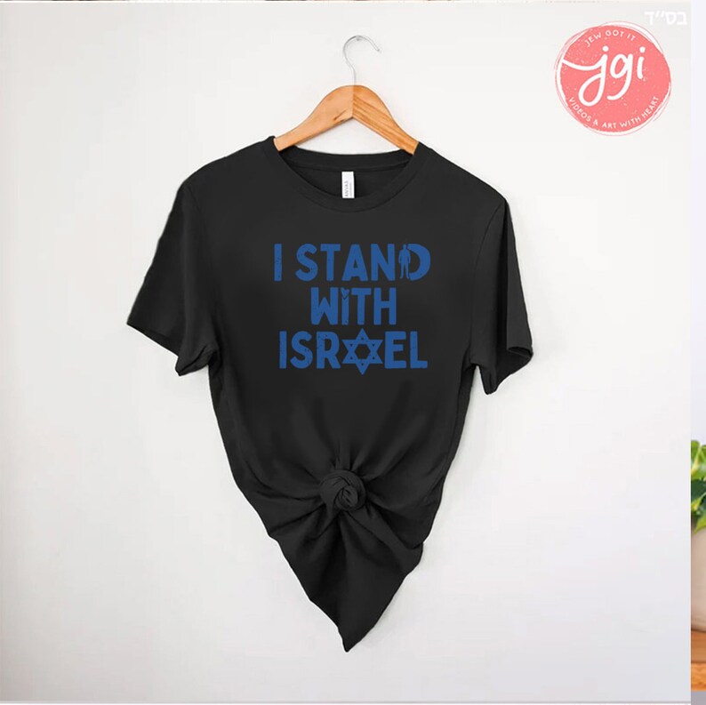 May include: Black t-shirt with the text "I Stand With Israel" in blue lettering and a blue Star of David.