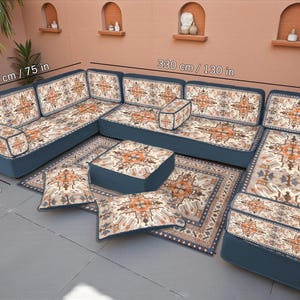 May include: A U-shaped seating set with a patterned rug and cushions. The navy blue sofa has patterned cushions. The set measures 190 cm by 70 cm, and 330 cm. The text "U SET" is visible. The measurements are also shown in inches.