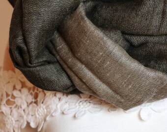 May include: A brown and dark brown pashmina scarf with a soft, textured feel.