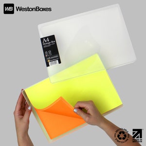May include: A clear plastic storage box with a yellow and orange sheet of paper inside. The box is labeled "A4 Storage Box" and "craft essentials". The box is made of recyclable polypropylene and is made in Britain.