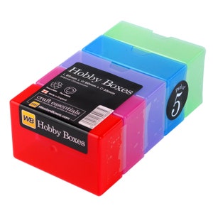 May include: A pack of five colourful plastic storage boxes. The boxes are stacked on top of each other and are labelled "Hobby Boxes". The boxes are made in England and are recyclable and reusable. The boxes are 95mm long, 60mm wide, and 35mm deep.