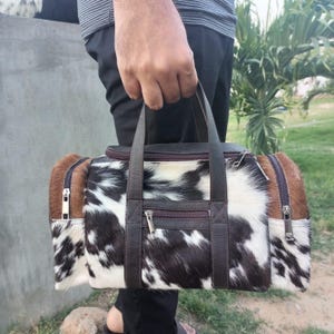 set of two cowhide leather duffel set one large duffel bag with a matching small toiletry bag , weekender bag cowhide bag