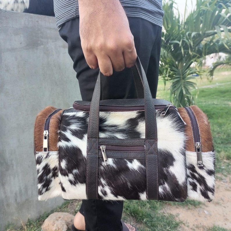 set of two cowhide leather duffel set one large duffel bag with a matching small toiletry bag , weekender bag cowhide bag