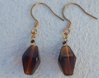Boucles d'oreilles en or marron transparentes en forme de perle de verre