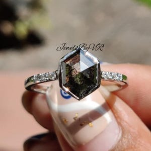 salt and pepper diamond ring, hexagon engagement ring, salt and pepper diamond hexagon, galaxy diamond ring, unique diamond inclusions, grey diamond engagement ring, jewels by vr, bezel set hexagon ring, alternative engagement ring, geometric diamond ring, black and white diamond, salt and pepper lab diamond, hexagon cut jewelry, modern noir bridal, edgy engagement ring, salt and pepper rose gold, 14k white gold hexagon ring, celestial engagement ring, speckle diamond ring