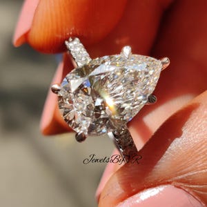 3.0 CT Pear Cut Moissanite Engagement Ring Hidden Halo Pave 18K White Gold