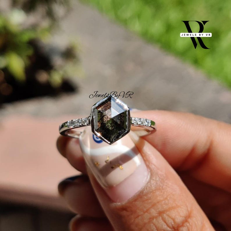 salt and pepper diamond ring, hexagon engagement ring, salt and pepper diamond hexagon, galaxy diamond ring, unique diamond inclusions, grey diamond engagement ring, jewels by vr, bezel set hexagon ring, alternative engagement ring, geometric diamond ring, black and white diamond, salt and pepper lab diamond, hexagon cut jewelry, modern noir bridal, edgy engagement ring, salt and pepper rose gold, 14k white gold hexagon ring, celestial engagement ring, speckle diamond ring