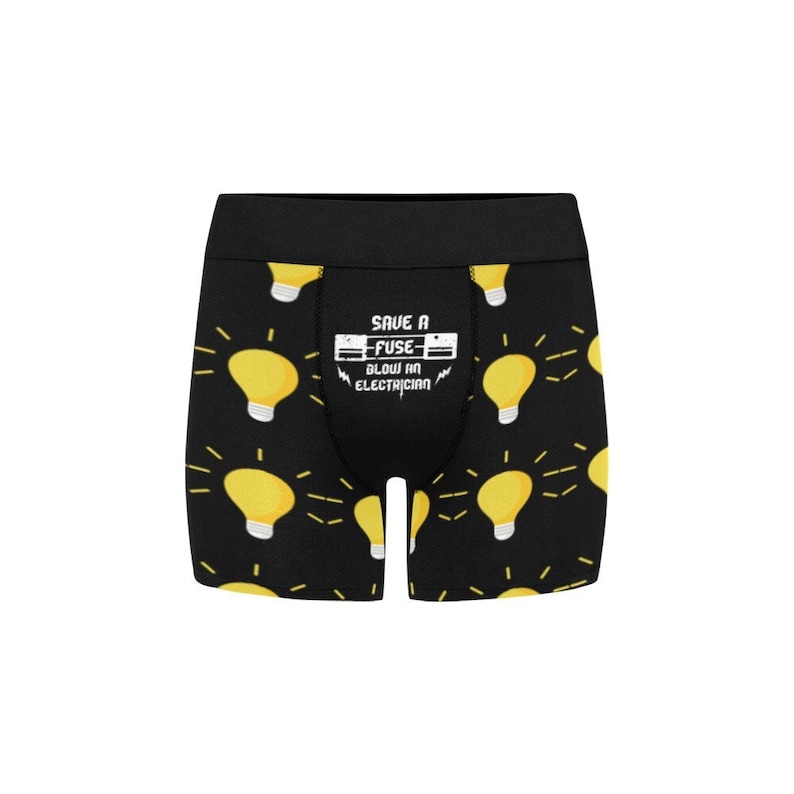 May include: Black boxer briefs with a repeating pattern of yellow light bulbs with radiating lines. The waistband is black. The front of the briefs has the text "SAVE A FUSE BLOW AN ELECTRICIAN".