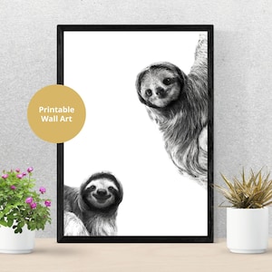 May include: Black and white printable wall art featuring two sloths. The sloths are drawn in a realistic style and have a friendly expression. The text "Printable Wall Art" is included in the image.