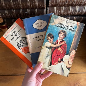 May include: Three Penguin Books paperbacks: "Lady Chatterley's Lover", "Gilbert & Sullivan", and "Jane Austen Mansfield Park".
