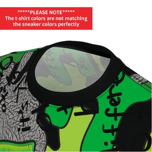 Puede incluir: Una camiseta negra con un estampado verde, negro y blanco. El estampado presenta un dise&ntilde;o gr&aacute;fico con el texto "iffere". La camiseta tiene un cuello redondo negro.