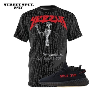 May include: Black and white t-shirt with a skeleton graphic and the text "YEEZUS" and "GOD WANTS YOU".  Black and white sneakers with red text that says "SPLY-350".