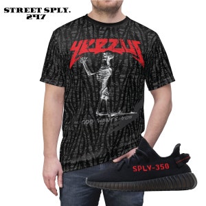 May include: Black and red t-shirt with a skeleton graphic and the text "YEEZUS" and "GOD WANTS YOU". Black and red sneakers with the text "SPLY-350".