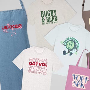May include: A selection of South African themed clothing and accessories. Includes a denim apron with "LEKKER" text, t-shirts with phrases like "RUGBY & BEER", "GATVOL", and "JOU MA", tote bags, and a brown apron with a traffic light graphic.