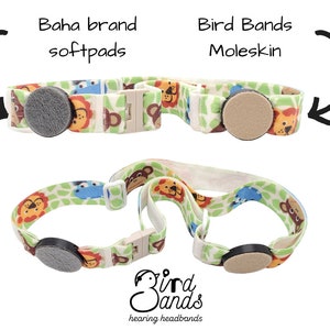 May include: Two hearing aid headband styles with different soft pads. The top headband has a tan moleskin pad and the bottom headband has a gray soft pad. Both headbands have a jungle animal print with lions, monkeys, and giraffes. The text "Bird Bands hearing headbands" is printed on the bottom of the image.