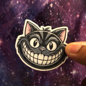 CHESHIRE CAT1 2.5x2.0 inch Sticker- High Quality Matt Vinyl and Waterproof - For laptop, fridge or car. Great gift.