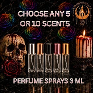 May include: Five clear 3 ml glass perfume spray bottles with metallic caps in silver, rose gold, black, pink, and gold. The text reads CHOOSE ANY 5 OR 10 SCENTS and PERFUME SPRAYS 3 ML. The background features a skull, roses, and a candle.
