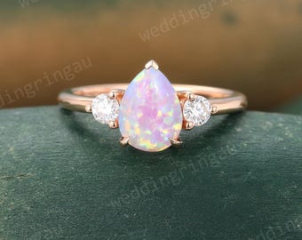Teardrop Pink Opal ring Unique Rose gold Pear shaped engagement ring Round Moissanite ring Three stone wedding ring Bridal Promise ring