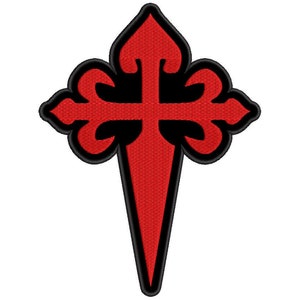 Può includere: Una croce rossa e nera con una punta, nota come la Croce dell'Ordine di Santiago, simbolo dell'Ordine di Santiago, un ordine militare spagnolo.