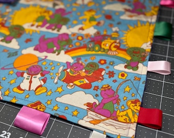 Purple Dinosaur Themed Taggie Blanket