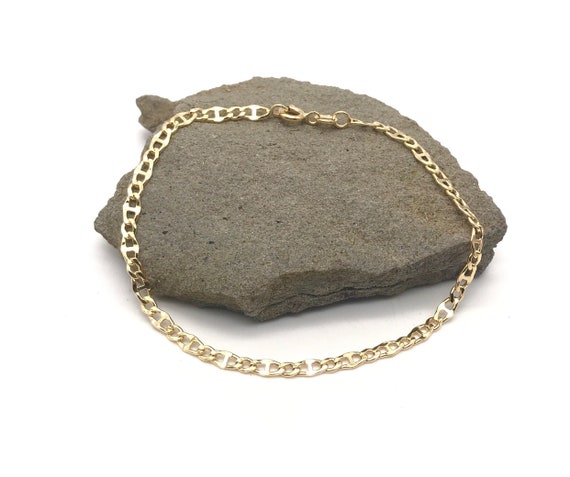 Sold at Auction: BRACELET '1955'. YELLOW GOLD (750/1000), 58.1 G.