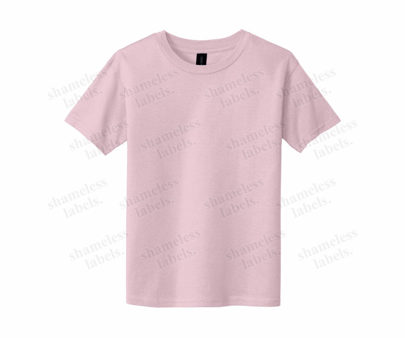 May include: A pink t-shirt with the words "shameless labels" repeated in a pattern across the front.