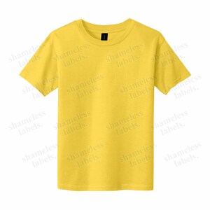 May include: A yellow short-sleeved t-shirt with the text "shameless labels." repeated across the front.