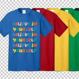 May include: A row of short-sleeved t-shirts in various colors: blue, red, yellow, green, and gray. The blue shirt features the text "BELIEVE IN YOURSELF" in colorful, bubble-style letters. The shirts are plain on the back.