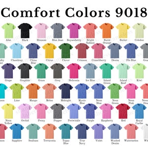 May include: A chart of 48 different coloured t-shirts, each with the name of the colour printed below. The t-shirts are arranged in rows of 8, with the text "Comfort Colors 9018" at the top.