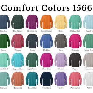 May include: A chart of 20 different colors of Comfort Colors 1566 sweatshirts. The colors are arranged in four rows of five. The colors include blue jean, blue spruce, boysenberry, burnt orange, butter, chalky mint, chambray, clover, crimson, denim, flo blue, grey, heliconia, island green, island reef, lagoon blue, light green, neon pink, orchid, pepper, sandstone, seafoam, terracotta, topaz blue, true navy, violet, watermelon, and white.