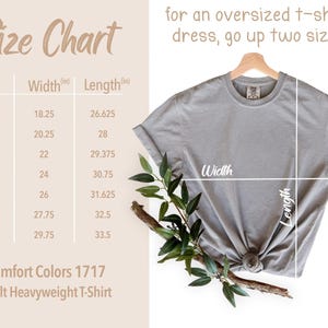 May include: A size chart for Comfort Colors 1717 adult heavyweight t-shirts. The chart shows sizes S to 4XL with width and length measurements in inches. A gray t-shirt is displayed on a hanger, with width and length lines drawn on it.