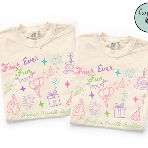 May include: Two cream-colored t-shirts featuring a colorful birthday-themed graphic print. The design includes the text "Four Ever Fun" and "Emma's Fourth Birthday," alongside illustrations of a birthday cake, balloons, gifts, and party hats.