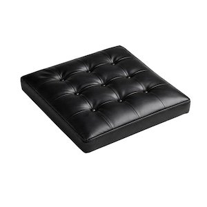 May include: A square black cushion featuring a tufted surface with nine evenly spaced buttons. The cushion has a smooth, uniform texture and a structured, low-profile design with clean, straight edges, presenting a solid black color throughout.