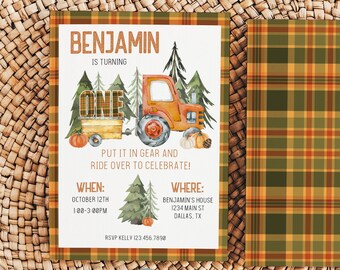 May include: An invitation design with a tractor theme for a first birthday. The invitation features an orange tractor, pumpkins, and trees. The text reads "Benjamin is turning one" and includes event details. The background is a plaid pattern.