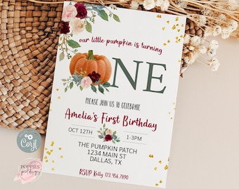 May include: A white invitation card with the text "our little pumpkin is turning ONE" and "Amelia's First Birthday". The card features a pumpkin illustration and floral accents. Gold confetti dots the background.