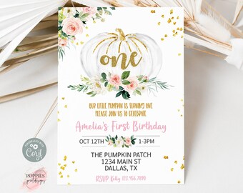 May include: White invitation card with a gold glitter pumpkin design and floral accents. The text reads "one" in gold, with details for Amelia's first birthday, including date, time, and location.