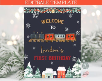 May include: A navy blue birthday sign with the text "WELCOME TO Landon's FIRST BIRTHDAY". The sign features a watercolor train, snowflakes, and winter village illustrations. The top of the sign has a decorative garland.