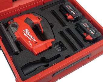 May include: A red Milwaukee FUEL jigsaw with a black handle and a black dust blower, two red and black M18 batteries, and a black carrying case.