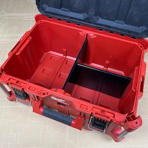 May include: Red and black tool box with a removable divider inside. The box has a handle and a latch.