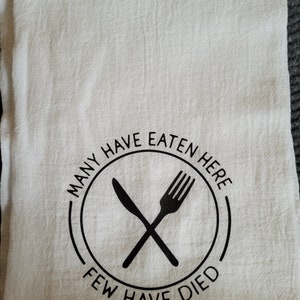 Many Have Eaten Here, Few Have Died Design Kitchen Towel — Potter's Printing