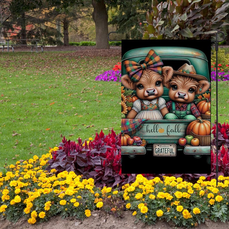May include: A garden flag featuring two cartoon cows in a vintage green truck bed, surrounded by pumpkins and fall foliage. The flag has the text "hell fall" and "GRATEFUL" on the license plate. The cows wear fall-themed outfits.